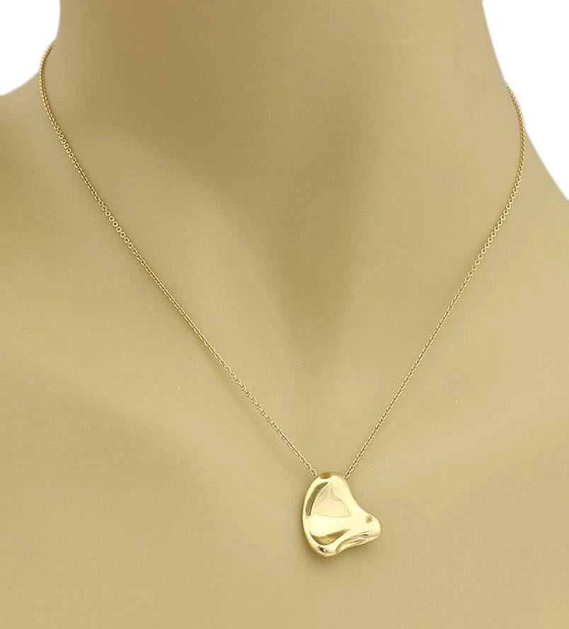 TIFFANY & CO. FULL HEART GOLD PENDANT 18K YELLOW W/ CHAIN: TIFFANY & CO. FULL HEART GOLD PENDANT 18K YELLOW W/ CHAIN This lovely pendant and chain necklace is from Tiffany & Co. by Elsa Peretti from her Full Heart Collection, it is crafted from18k yellow gold