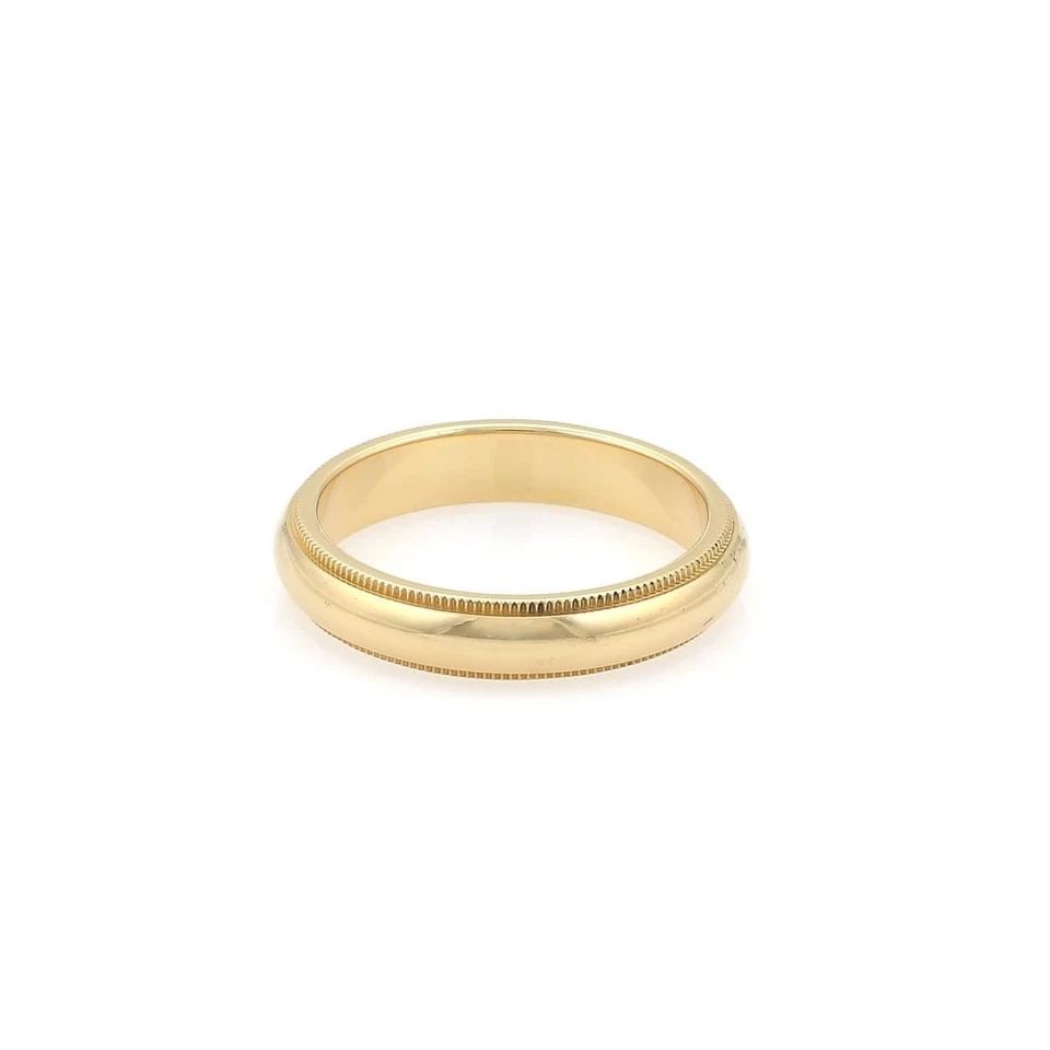 TIFFANY & CO. WEDDING BAND 18K YELLOW GOLD DOUBLE MILGRAIN DESIGN RING SIZE 7.5: TIFFANY & CO. WEDDING BAND 18K YELLOW GOLD DOUBLE MILGRAIN DESIGN RING SIZE 7.5 The Tiffany & Co. Wedding Band is a stunning 18k yellow gold ring with a double milgrain design, perfect for a special o