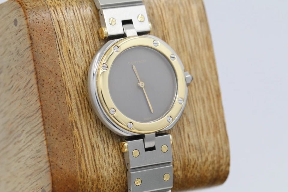 CARTIER SANTOS VENDOME TWO TONE 18K/STEEL 27MM GREY GHOST DIAL WOMAN'S WATCH: CARTIER SANTOS VENDOME TWO TONE 18K/STEEL 27MM GREY GHOST DIAL WOMAN'S WATCH Description Cartier Santos Vendome Two Tone 18K/Steel 27mm Grey Ghost Dial Woman's Watch The watch has been used previously