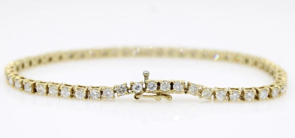 14K YELLOW GOLD 4.25 TCW NATURAL DIAMOND TENNIS BRACELET 7" - 9.9 GRAMS: 14K YELLOW GOLD 4.25 TCW NATURAL DIAMOND TENNIS BRACELET 7" - 9.9 GRAMS 14K YELLOW GOLD 4.25 TCW NATURAL DIAMOND TENNIS BRACELET 7" - 9.9 GRAMS Description 14K Yellow Gold 4.25 TCW Natural Diamond Ten