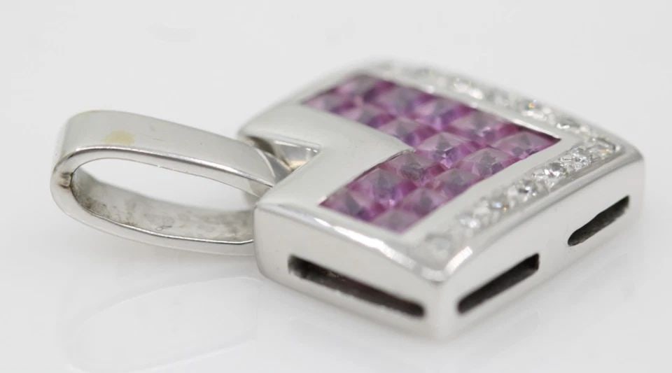 LEVIAN 18K WHITE GOLD PINK SAPPHIRE & DIAMOND PENDANT 1" ~ 6.5 GR: LEVIAN 18K WHITE GOLD PINK SAPPHIRE & DIAMOND PENDANT 1" ~ 6.5 GR Description Levian 18K White Gold Pink Sapphire & Diamond Pendant Pendant is in good condition. May show signs of wear and/or tear. Ap