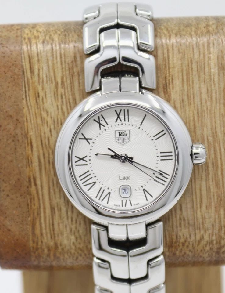 TAG HEUER LINK 29MM WHITE DIAL ROMAN STEEL SWISS QUARTZ WOMEN'S WATCH WAT1416: TAG HEUER LINK 29MM WHITE DIAL ROMAN STEEL SWISS QUARTZ WOMEN'S WATCH WAT1416 Description Tag Heuer Link 29 mm White Dial Roman Steel Swiss Quartz Women's Watch WAT1416 The watch has been used previou