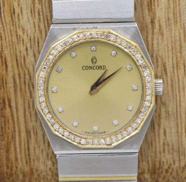 CONCORD MARINER 18K TWO-TONE DIAMOND QUARTZ 25MM GOLD DIAL WATCH 15-62-148: CONCORD MARINER 18K TWO-TONE DIAMOND QUARTZ 25MM GOLD DIAL WATCH 15-62-148 Description Concord Mariner 18K Two-Tone Diamond Quartz 25mm Gold Dial Watch 15-62-148 The watch has been used previously. Th