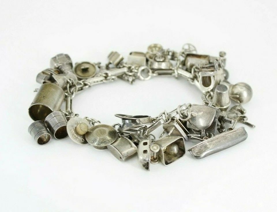 VINTAGE STERLING SILVER 30 CHARM BRACELET WESTERN COWBOY TOYS 7" ~ 58.3 GRAMS: VINTAGE STERLING SILVER 30 CHARM BRACELET WESTERN COWBOY TOYS 7" ~ 58.3 GRAMS VINTAGE STERLING SILVER 30 CHARM BRACELET WESTERN COWBOY TOYS 7" ~ 58.3 GRAMS Description Vintage Sterling Silver 30 Charm