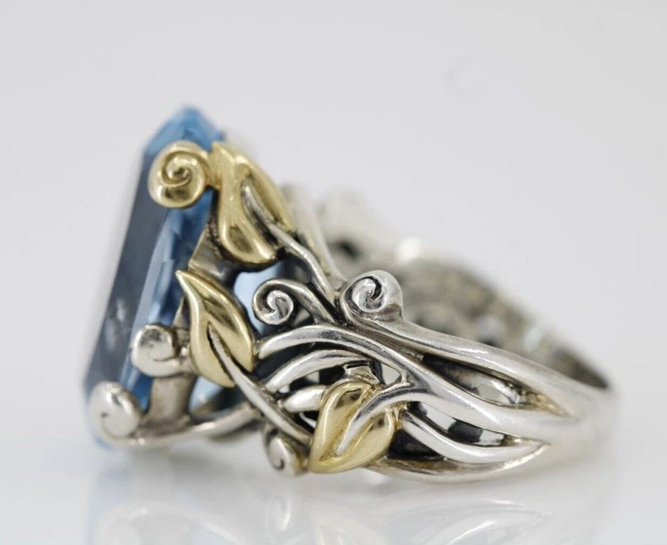 BARBARA BIXBY STERLING & 18K 14.0 CT BLUE TOPAZ VINE RING SIZE 7: BARBARA BIXBY STERLING & 18K 14.0 CT BLUE TOPAZ VINE RING SIZE 7 BARBARA BIXBY STERLING & 18K 14.0 CT BLUE TOPAZ VINE RING SIZE 7 Description Barbara Bixby Sterling & 18K 14.0 ct Blue Topaz Vine Ring 