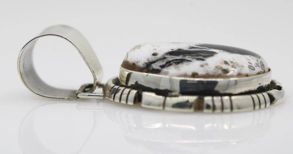 DANNY CLARK NAVAJO STERLING SILVER WHITE BUFFALO TURQUOISE PENDANT 14.5 GRAMS: DANNY CLARK NAVAJO STERLING SILVER WHITE BUFFALO TURQUOISE PENDANT 14.5 GRAMS Description Danny Clark Navajo Sterling Silver White Buffalo Turquoise Pendant Item is in great condition. May show signs 