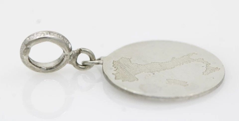 TEDORA STERLING SILVER 925 ITALY PENDANT 2.5 GRAMS: TEDORA STERLING SILVER 925 ITALY PENDANT 2.5 GRAMS Description Rare! Charriol Blanche Flamme Collection 18k White Gold Diamond Bangle Bracelet Item is in good condition. May show signs of wear and/or 