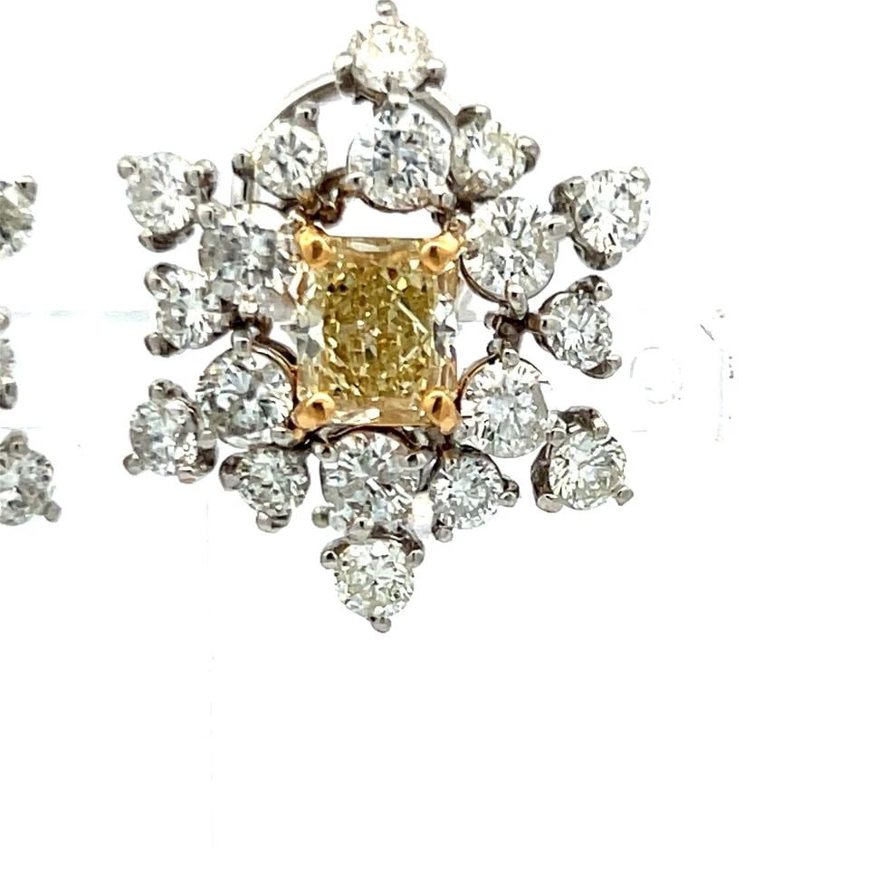 7.36 CARAT ROUND AND RADIANT CUT FANCY BROWN YELLOW DIAMOND PLAT EARRINGS: 7.36 CARAT ROUND AND RADIANT CUT FANCY BROWN YELLOW DIAMOND PLAT EARRINGS Title: 7.36 Carat Round Brilliant I SI1 and Radiant Cut Fancy Brown Yellow-Fancy Light Brownish Yellow I1-VS2 Diamond Platinum