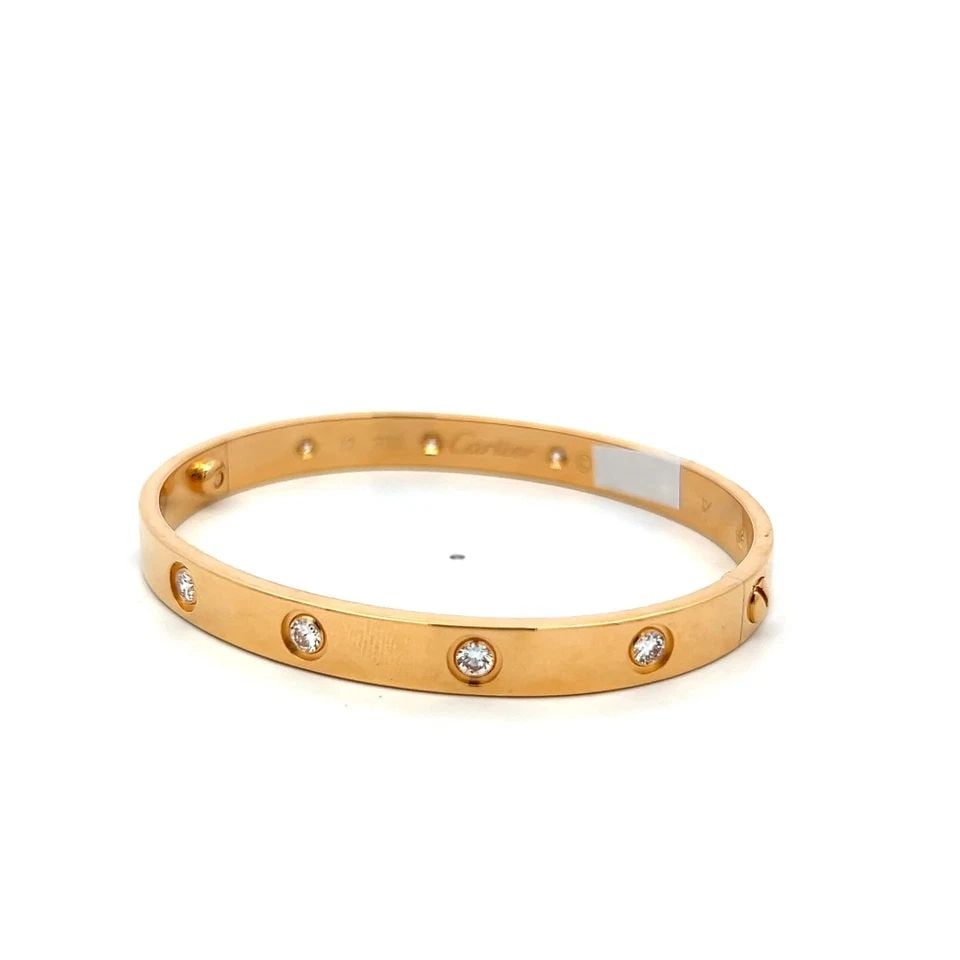 CARTIER 18 KARAT YELLOW GOLD LOVE BRACELET 0.96 CARAT ROUND DIAMONDS SIZE 17: CARTIER 18 KARAT YELLOW GOLD LOVE BRACELET 0.96 CARAT ROUND DIAMONDS SIZE 17 CARTIER 18 KARAT YELLOW GOLD LOVE BRACELET 0.96 CARAT ROUND DIAMONDS SIZE 17 PRODUCT DESCRIPTION Designer: CARTIER Detailed