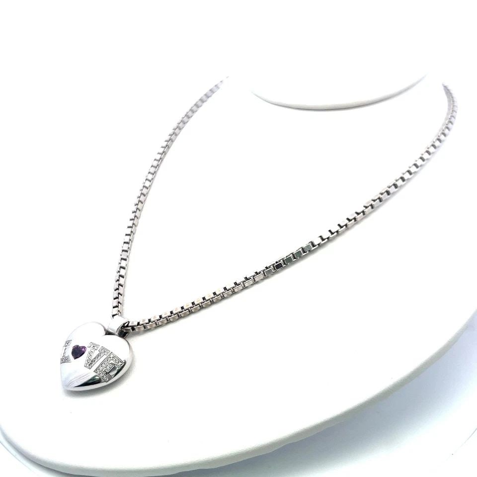 CHOPARD 0.50CT TOURMALINE & 0.20CT DIAMOND HEART PENDANT IN 18K WHITE GOLD: CHOPARD 0.50CT TOURMALINE & 0.20CT DIAMOND HEART PENDANT IN 18K WHITE GOLD PRODUCT DESCRIPTION Designer: CHOPARD Title: Chopard 0.50 Carat Heart Shape Tourmaline 0.20 Carat Round Brilliant G VS Diamon