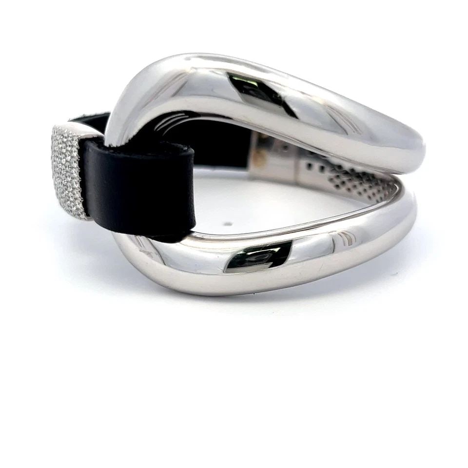 0.72 CARAT ROUND BRILLIANT I VS2 DIAMOND 18 KARAT WHITE GOLD CUFF BRACELET: 0.72 CARAT ROUND BRILLIANT I VS2 DIAMOND 18 KARAT WHITE GOLD CUFF BRACELET PRODUCT DESCRIPTION Title: 0.72 Carat Round Brilliant I VS2 Diamond 18 Karat White Gold Cuff Bracelet Style: Cuff Metal: 18 K