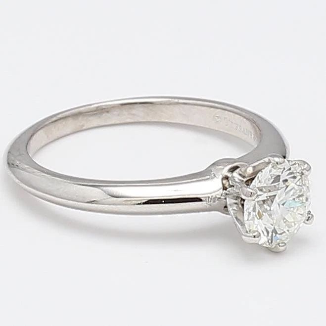TIFFANY & CO 1.15 CARAT ROUND BRILLIANT H VS1 DIAMOND PLATINUM ENGAGEMENT RING: TIFFANY & CO 1.15 CARAT ROUND BRILLIANT H VS1 DIAMOND PLATINUM ENGAGEMENT RING Designer: Tiffany & Co Title: Tiffany & Co 1.15 Carat Round Brilliant H VS1 Diamond Platinum Engagement Ring Style: Engag