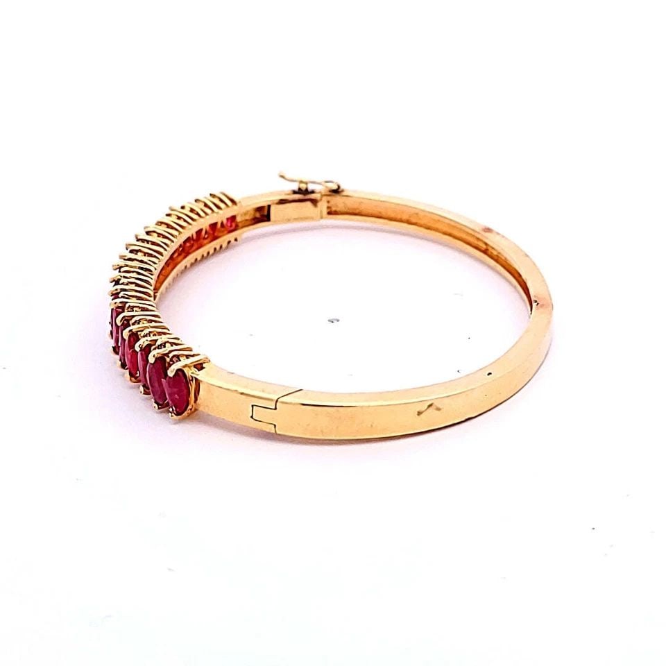 5.95CT MARQUISE RUBY & 0.85CT ROUND BRILLIANT DIAMOND BANGLE IN 14K YELLOW GOLD: 5.95 CARAT RUBY 0.85 CARAT ROUND BRILLIANT DIAMOND 14K YG BANGLE BRACELET Title: 5.95 Carat Marquis Shape Ruby 0.85 Carat Round Brilliant M I2 Diamond 14 Karat Yellow Gold Bangle Bracelet Style: Bangl
