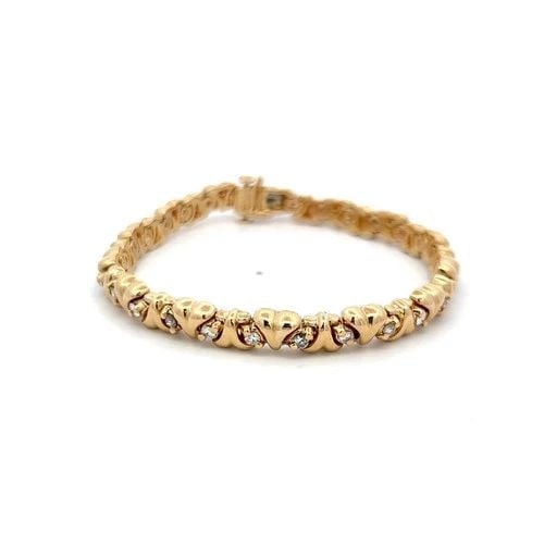 VINTAGE 14K YELLOW GOLD TENNIS BRACELET WITH 1 CARAT ROUND H-VS DIAMONDS: VINTAGE 14K YELLOW GOLD TENNIS BRACELET WITH 1 CARAT ROUND H-VS DIAMONDS Detailed Description: Elevate your style with this vintage tennis bracelet, crafted in 14K yellow gold. Featuring 28 round bril