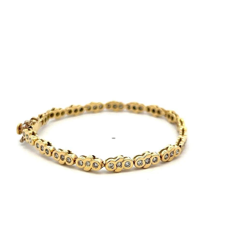 1.11CT ROUND DIAMOND TENNIS BRACELET IN 14K YELLOW GOLD VINTAGE ESTATE: 1.11CT ROUND DIAMOND TENNIS BRACELET IN 14K YELLOW GOLD VINTAGE ESTATE 1.11CT ROUND DIAMOND TENNIS BRACELET IN 14K YELLOW GOLD VINTAGE ESTATE $5,620.00 PRODUCT DESCRIPTION Title: This vintage 14K yell