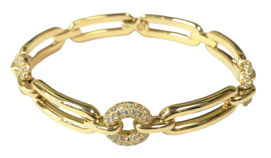 MOVADO 18K YELLOW GOLD BRACELET WITH 1.32CTW DIAMONDS (7.75 INCH) 44.9 GRAMS: MOVADO 18K YELLOW GOLD BRACELET WITH DIAMONDS 7.75 INCH Movado 18k Yellow Gold Bracelet with Diamonds You are bidding on a pre-owned Movado 18k Yellow Gold Bracelet with Diamonds. The piece has marks 