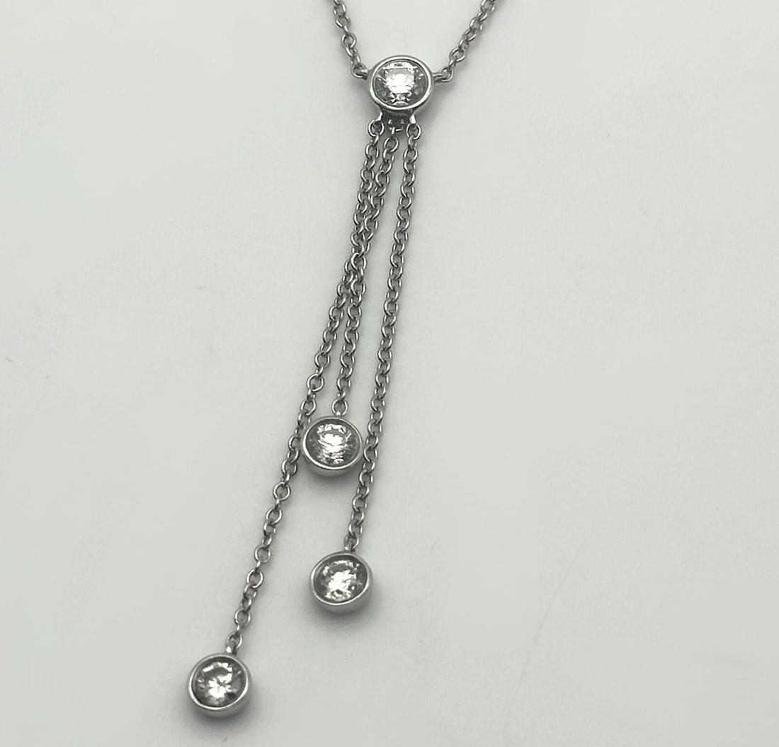 TIFFANY & CO. PLATINUM TRIPLE DIAMOND DROP LAVALIER NECKLACE ( 16 INCH ) 3.4G: TIFFANY & CO. PLATINUM TRIPLE DIAMOND DROP LAVALIER NECKLACE 16 INCHES 3.4G Tiffany & Co. Platinum Triple Diamond Drop Lavalier Necklace Condition: Used, has been cleaned Material: 950 Platinum Neckla