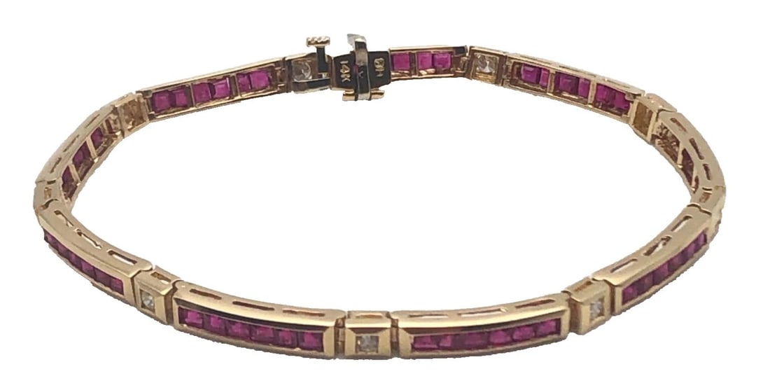 14K GOLD BRACELET, 5.4CTS OF RUBIES, 0.27CTS OF DIAMONDS ( 7.25 INCH ) 11.4G: 14K GOLD BRACELET WITH 5.4CTS NATURAL RUBIES AND 0.27CTS OF DIAMONDS 7.25" 14k Gold Linked Bracelet set with Natural Rubies and 0.27cts of Diamonds Condition: Used, has been fully cleaned buffed and p