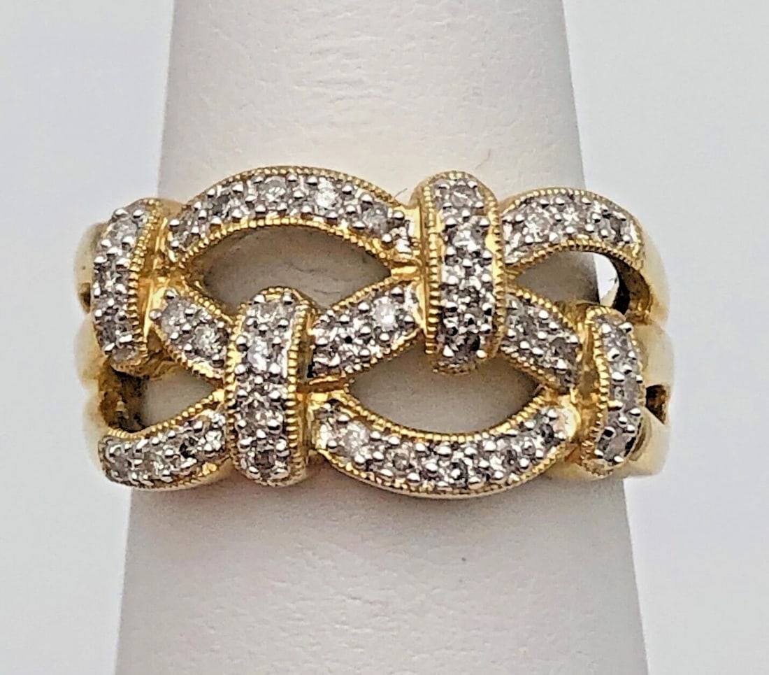 14K GOLD WEAVED STYLE RING SET WITH 0.25CTS OF DIAMONDS SIZE: 7.25 6.1G: 14k Yellow Gold Weaved style Ring set with 0.25cts of Diamonds Condition: New with original tag, has been moved around in inventory and display Material: 14k Yellow Gold Ring Size: 7.25 Weight: 6.1 gr