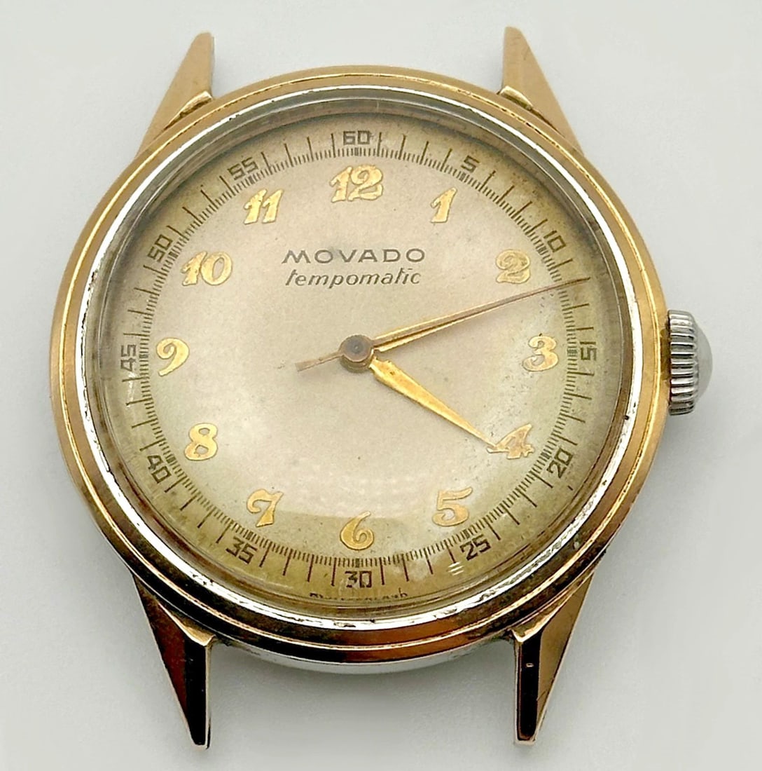 VINTAGE MOVADO TEMPOMATIC WATCH, 14K GOLD/STAINLESS CASE ( NO BAND ): Vintage Movado Tempomatic Watch, 14k Gold and Stainless Case Condition: Vintage, Movement has been overhauled and serviced on 6/20/2025 runs and keeps time perfectly Material: 14k Yellow Gold and Stai