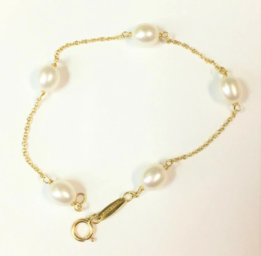 TIFFANY & CO. ELSA PERETTI 18K GOLD PEARLS BY THE YARD BRACELET ( 7 INCH ) 2.8G: Tiffany & Co. Elsa Peretti 18k Gold Pearls by the yard Bracelet You are bidding on a pre-owned Tiffany & Co. Elsa Peretti 18k Yellow Gold Pearls by the yard bracelet. The bracelet has some marks and s
