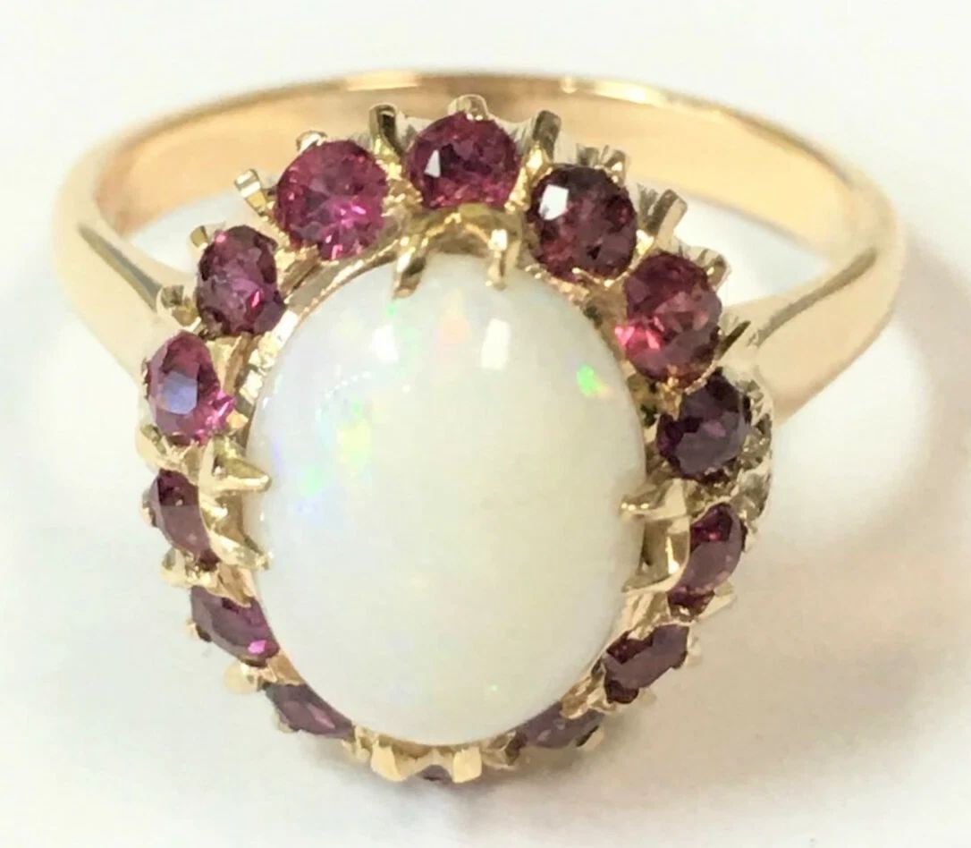 VINTAGE 14K 0.56CTS NATURAL RUBY, NATURAL OPAL RING (SIZE: 5.5) 4.3 GRAMS: VINTAGE 14K NATURAL RUBY, NATURAL OPAL RING (SIZE: 5.5) Vintage 14k Natural Ruby, Natural Opal Ring You are bidding on a pre-owned Vintage 14k Natural Ruby, Natural Opal Ring. The piece has marks and 