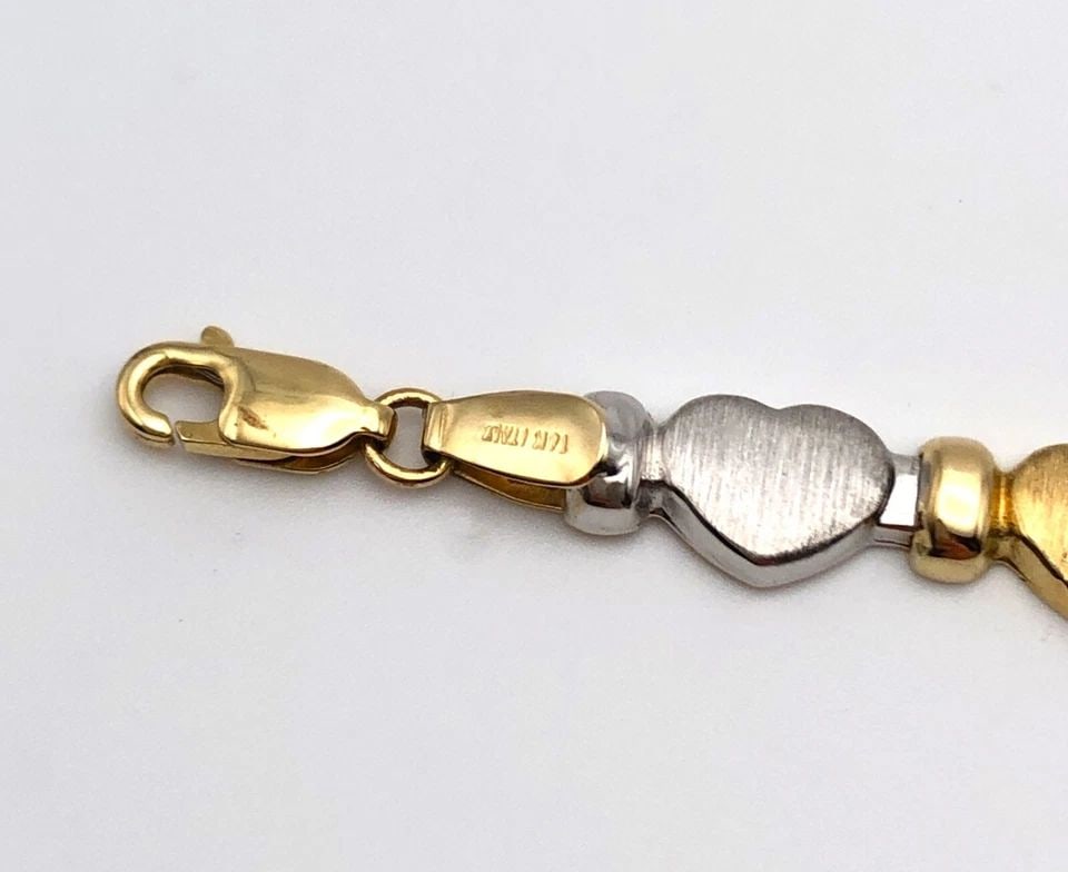 14K WHITE AND YELLOW GOLD HEART LINKED BRACELET ( 7.5 INCH ) 5.5G: 14K WHITE AND YELLOW GOLD HEART LINKED BRACELET 7.5" 5.5 GRAMS 14k White and Yellow Gold Heart Linked Bracelet Condition: Used Material: 14k White and Yellow Gold Weight: 5.5 grams Bracelet Size: 7.5"