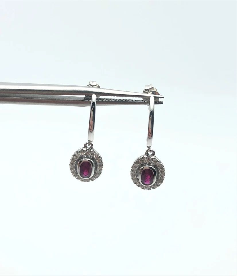 14K WHITE GOLD DANGLE EARRINGS, NATURAL RUBIES AND 0.30CTW DIAMONDS 2.6 GRAMS: 14K WHITE GOLD NATURAL RUBY DIAMOND EARRINGS 14k White Gold Natural Ruby Diamond Earrings You are bidding on a 14k White Gold Natural Ruby Diamond Earrings. The set has been fully checked and inspecte