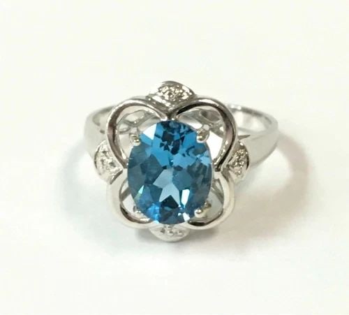 14K WHITE GOLD FLOWER STYLE RING WITH OVAL BLUE TOPAZ (SIZE 6.5) 2.8 GRAMS (1 of 2)