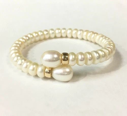 WHITE PEARL BANGLE WITH 14K ACCENTS (6 INCH WRIST) 15.4G: WHITE PEARL BANGLE WITH 14K ACCENTS (6 INCH WRIST) White Pearl Bangle with 14k Accents You are bidding on a White Pearl Bangle with 14k Accents. Bracelet is in good condition but one of the gold accen