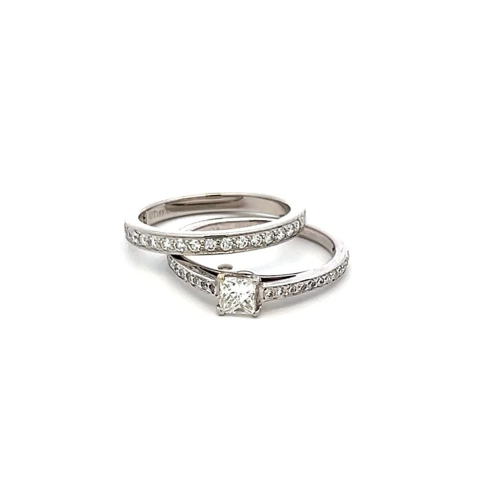 TIFFANY & CO 0.83 CARAT ROUND AND PRINCESS CUT DIAMOND PLATINUM ENGAGEMENT RING: TIFFANY & CO 0.83 CARAT ROUND AND PRINCESS CUT DIAMOND PLATINUM ENGAGEMENT RING PRODUCT DESCRIPTION Designer: Tiffany & Co Title: Tiffany & Co 0.83 Carat Round Brilliant F VS and Princess Cut F VS Dia