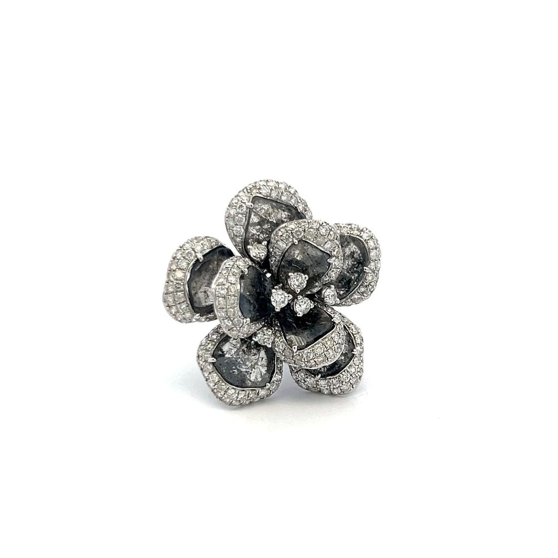 10.75CT ROUND BRILLIANT DIAMOND FLOWER COCKTAIL RING IN 18K WHITE GOLD (G SI): 10.75CT ROUND BRILLIANT DIAMOND FLOWER COCKTAIL RING IN 18K WHITE GOLD (G SI) Title: this is a bold, sculptural flower ring with rose-cut or slice-style dark gray/black diamonds, surrounded by pavé-s