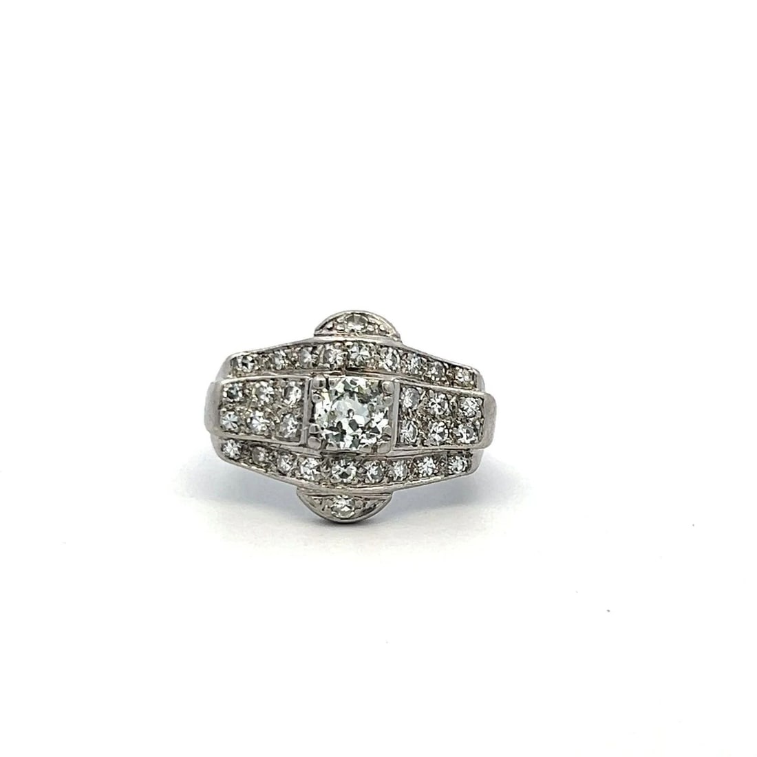 1.56CT OLD EUROPEAN CUT DIAMOND PLATINUM ART DECO ENGAGEMENT RING: 1.56CT OLD EUROPEAN CUT DIAMOND PLATINUM ART DECO ENGAGEMENT RING Title: A captivating Art Deco platinum engagement ring showcasing vintage charm and geometric sophistication. The centerpiece features