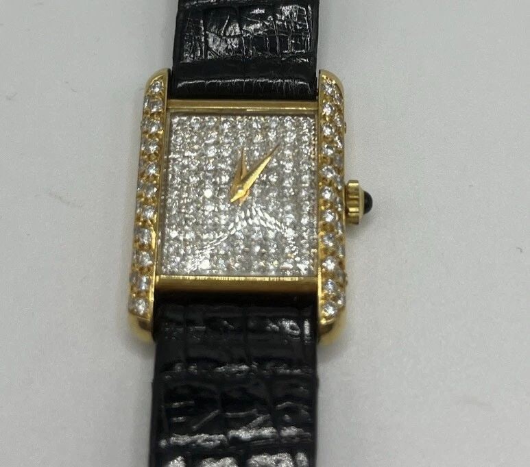 BUECHE GIROD 18K SOLID GOLD AND DIAMOND FACE WATCH: BUECHE GIROD 18K SOLID GOLD AND DIAMOND FACE WATCH BUECHE GIROD 18K SOLID GOLD AND DIAMOND FACE WATCH Introducing this luxurious rectangular Bueche Girod wristwatch, made from 18K solid gold with a st