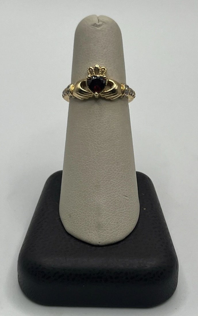 14K YELLOW GOLD CLADDAGH RING WITH GARNET STONE & DIAMONDS SIZE 6.5: 14K YELLOW GOLD CLADDAGH RING WITH GARNET STONE & DIAMONDS SIZE 6.5 14K YELLOW GOLD CLADDAGH RING WITH GARNET STONE & DIAMONDS SIZE 6.5 This beautiful 14K yellow gold Claddagh ring features a stunning