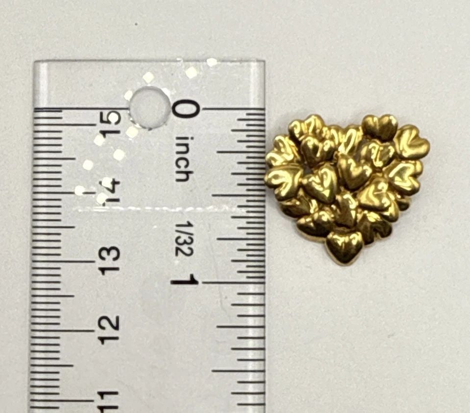 MOVADO 18K YELLOW GOLD HEART PIN/BROOCH: MOVADO 18K YELLOW GOLD HEART PIN/BROOCH MOVADO 18K YELLOW GOLD HEART PIN/BROOCH Elevate your accessory collection with the Movado 18K Yellow Gold Heart Pin/Brooch, a timeless piece that seamlessly mar