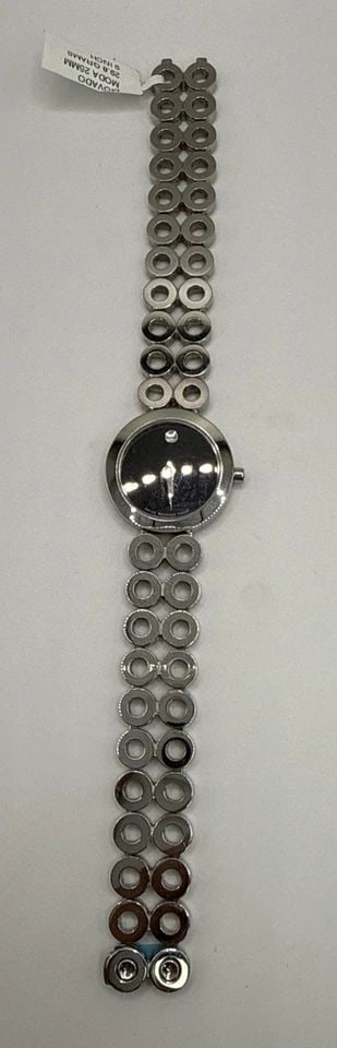 LADIES MOVADO STAINLESS STEEL MODA 9" BRACELET WATCH The Ladies Movado Stainless Steel Moda 9": The Ladies Movado Stainless Steel Moda 9" Bracelet Watch is a stylish and elegant timepiece designed for women. With a sleek silver stainless steel bracelet and a classic black dial, this Swiss-made w