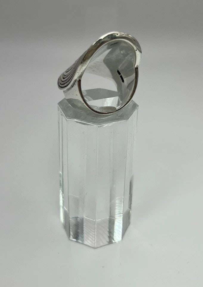 INDIRI COLLECTION RAYA RING SIZE 7: INDIRI COLLECTION RAYA RING SIZE 7 INDIRI COLLECTION RAYA RING SIZE 7 This sterling silver ring features traditional granulation and twisted wire designs. It reminds us of a shield, or perhaps a talis