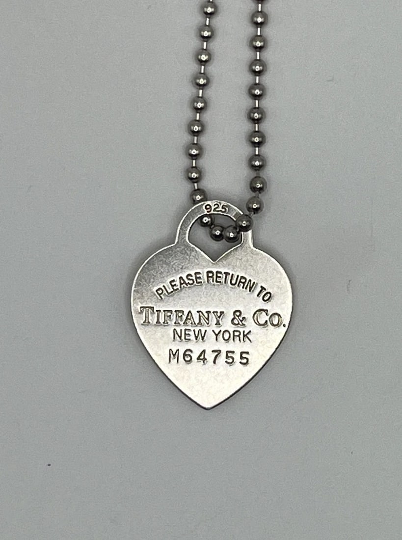 PLEASE RETURN TO TIFFANY 925 HEART PENDANT WITH 33" LONG BALL CHAIN: PLEASE RETURN TO TIFFANY 925 HEART PENDANT WITH 33" LONG BALL CHAIN PLEASE RETURN TO TIFFANY 925 HEART PENDANT WITH 33" LONG BALL CHAIN Please Return to Tiffany & Co. New York Heart Shaped Pendant