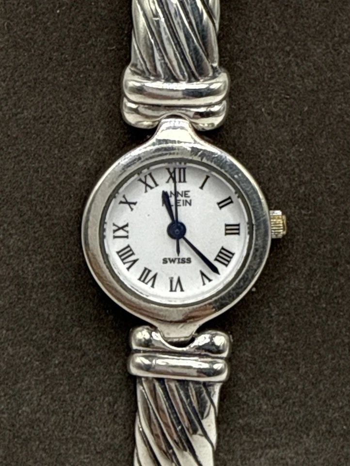 ANNE KLEIN WATCH STERLING SILVER VINTAGE BANGLE 925 WOMEN'S HEAVY 52.6 GRAMS: ANNE KLEIN WATCH STERLING SILVER VINTAGE BANGLE 925 WOMEN'S HEAVY 52.6 GRAMS This vintage Anne Klein watch features a quartz movement with Roman numerals and a 24-hour dial on a white face. The bangle