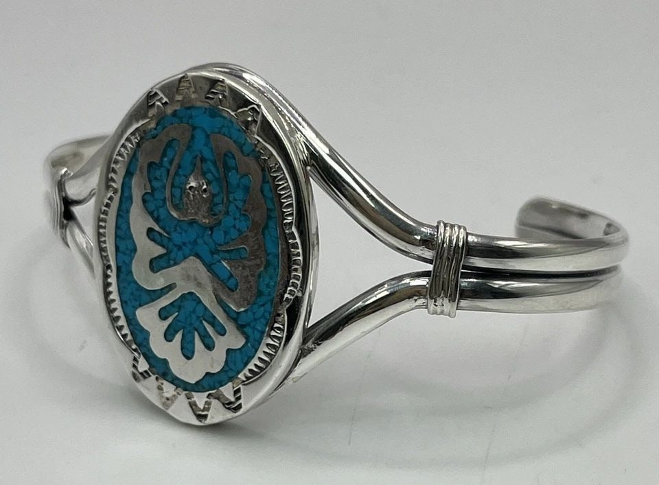 STERLING SILVER CUFF BRACELET WITH TURQUOISE INLAY - BIRD PATTERN: STERLING SILVER CUFF BRACELET WITH TURQUOISE INLAY - BIRD PATTERN STERLING SILVER CUFF BRACELET WITH TURQUOISE INLAY - BIRD PATTERN This exquisite bracelet features a stunning bird pattern with intric