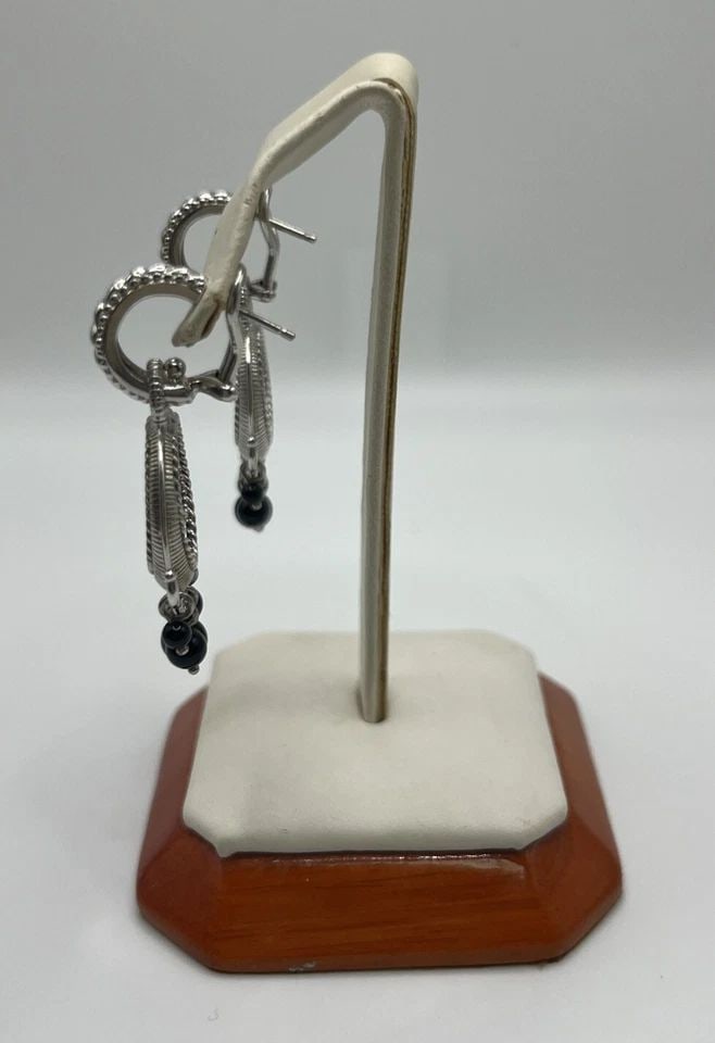 JUDITH RIPKA STERLING BLACK ONYX HOOP EARRINGS: JUDITH RIPKA STERLING BLACK ONYX HOOP EARRINGS JUDITH RIPKA STERLING BLACK ONYX HOOP EARRINGS Elevate your jewelry collection with these stunning Judith Ripka black onyx hoop earrings. The gemstone is