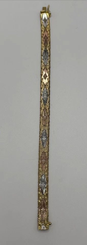 STERLING SILVER THREE TONE WOVEN 7.25" BRACELET 18.6 GRAMS: STERLING SILVER THREE TONE WOVEN 7.25" BRACELET 18.6 GRAMS This sterling silver bracelet features a unique woven design in three tones, making it a stylish and versatile accessory. Crafted with 925 st
