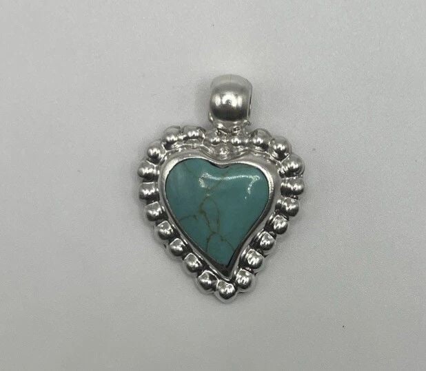 ATI MEXICO STERLING SILVER & TURQUOISE HEART PENDANT: ATI MEXICO STERLING SILVER & TURQUOISE HEART PENDANT ATI MEXICO STERLING SILVER & TURQUOISE HEART PENDANT Add a touch of Mexican ethnic and regional style to your jewelry collection with this beautifu