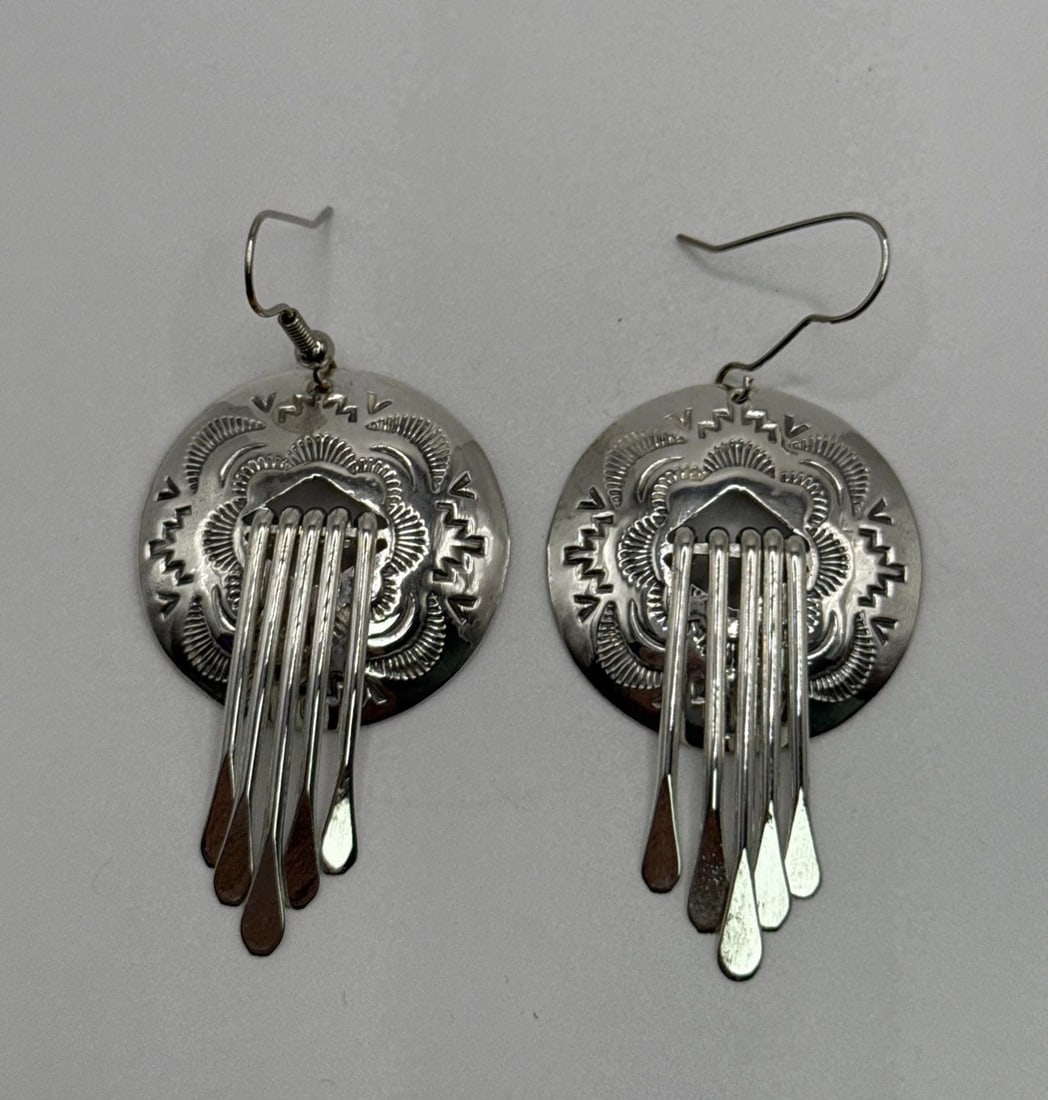 STERLING SILVER LARGE DANGLING CONCHO EARRINGS 11.2 GRAMS: STERLING SILVER LARGE DANGLING CONCHO EARRINGS 11.2 GRAMS These Sterling Silver Large Dangling Concho Earrings weigh 11.2 grams and are made of 925 silver. The style of these earrings is dangle/drop, 