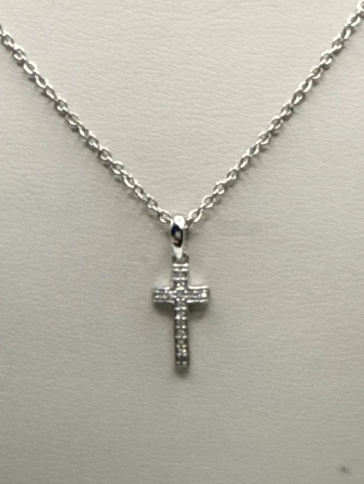 STERLING SILVER CROSS WITH COLORLESS STONES ON ADJUSTABLE 16" & 18" CHAIN: Sterling Silver Cross with Colorless Stones on Adjustable 16" & 18" Chain This Sterling Silver Cross pendant features colorless stones set on an adjustable 16" and 18" chain. The pendant shape is a cr
