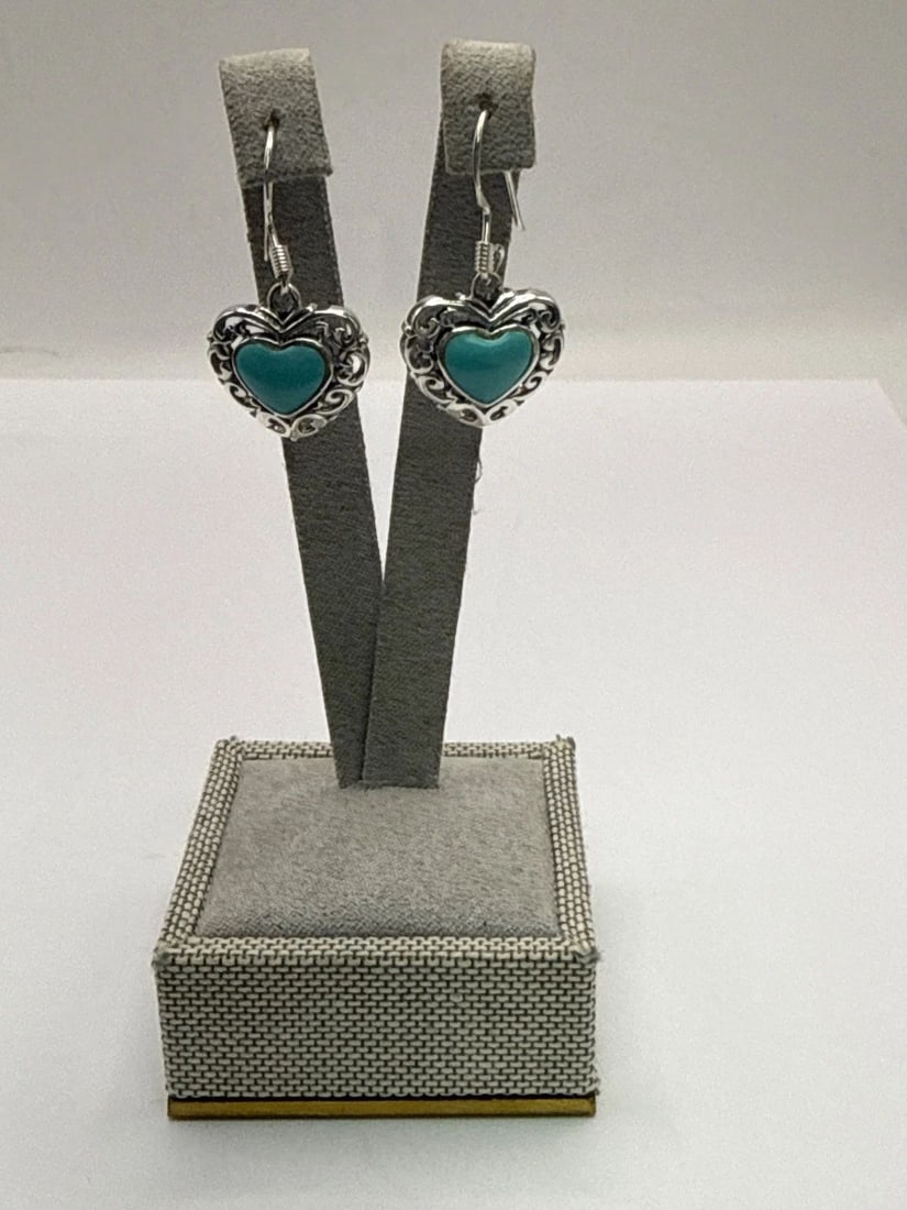 STERLING SILVER TURQUOISE HEART DANGLE EARRINGS: STERLING SILVER TURQUOISE HEART DANGLE EARRINGS These Sterling Silver Turquoise Heart Dangle Earrings are a beautiful addition to any jewelry collection. Created with natural turquoise stones in a hea