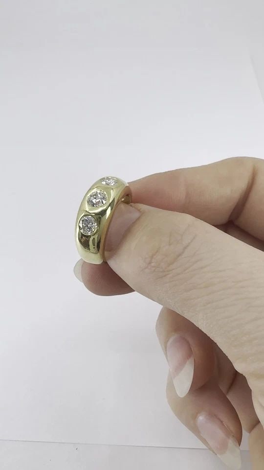 VINTAGE 18K YELLOW GOLD THREE STONE DIAMOND GYPSY RING: VINTAGE 18K YELLOW GOLD THREE STONE DIAMOND GYPSY RING KL TOOO This vintage 18k yellow gold three stone diamond ring reflects the traditional gypsy ring style, known for its solid construction and flu