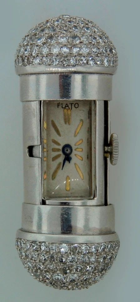 DIAMOND PLATINUM TRAVEL CLOCK WATCH PENDANT BY PAUL FLATO RARE ART DECO 1930S: DIAMOND PLATINUM TRAVEL CLOCK WATCH PENDANT BY PAUL FLATO RARE ART DECO 1930S Art Deco Diamond Platinum Travel Clock by Paul Flato This unique travel clock was created by Paul Flato in New York in the