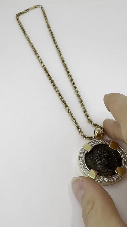 VINTAGE 14K GOLD DIAMOND ANCIENT COIN PENDANT NECKLACE: VINTAGE 14K GOLD DIAMOND ANCIENT COIN PENDANT NECKLACE KL TNTO This vintage coin pendant necklace centers on an authentic ancient Roman bronze coin dating to the Imperial Roman era, circa 1st–3rd ce